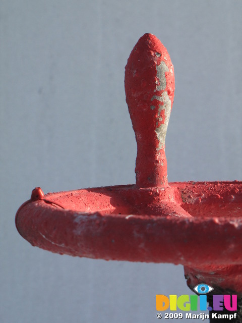 SX03007 Red paint flaking of lift valve on white background